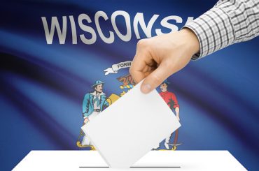 Voting concept - Ballot box with national flag on background - Wisconsin