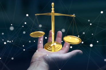 Businesswoman on blurred background with justice weighing scales 3D rendering